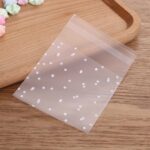 100 Uds bolsas de celofán transparente de plástico bolsa de regalo de galletas de caramelo de lunares con bolsa autoadhesiva DIY bolsas de celofán para fiesta, 10x15cm - Imagen 2