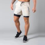 LYFT Pantalones cortos deportivos sueltos de secado rápido de doble capa para hombres, M - Imagen 2