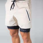 LYFT Pantalones cortos deportivos sueltos de secado rápido de doble capa para hombres, XXXL