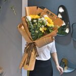 Material de embalaje de flores de regalo de periódico inglés de piel de vaca retro