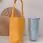 Taza de agua portátil Bolsa de café Aislamiento térmico al aire libre Cubierta de taza de lona de color sólido, Handheld (Yellow)