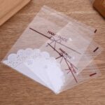Bolsas autoadhesivas para galletas con lazo de encaje blanco, embalaje para hornear, 100pcs /Pack 10x10cm - Imagen 2